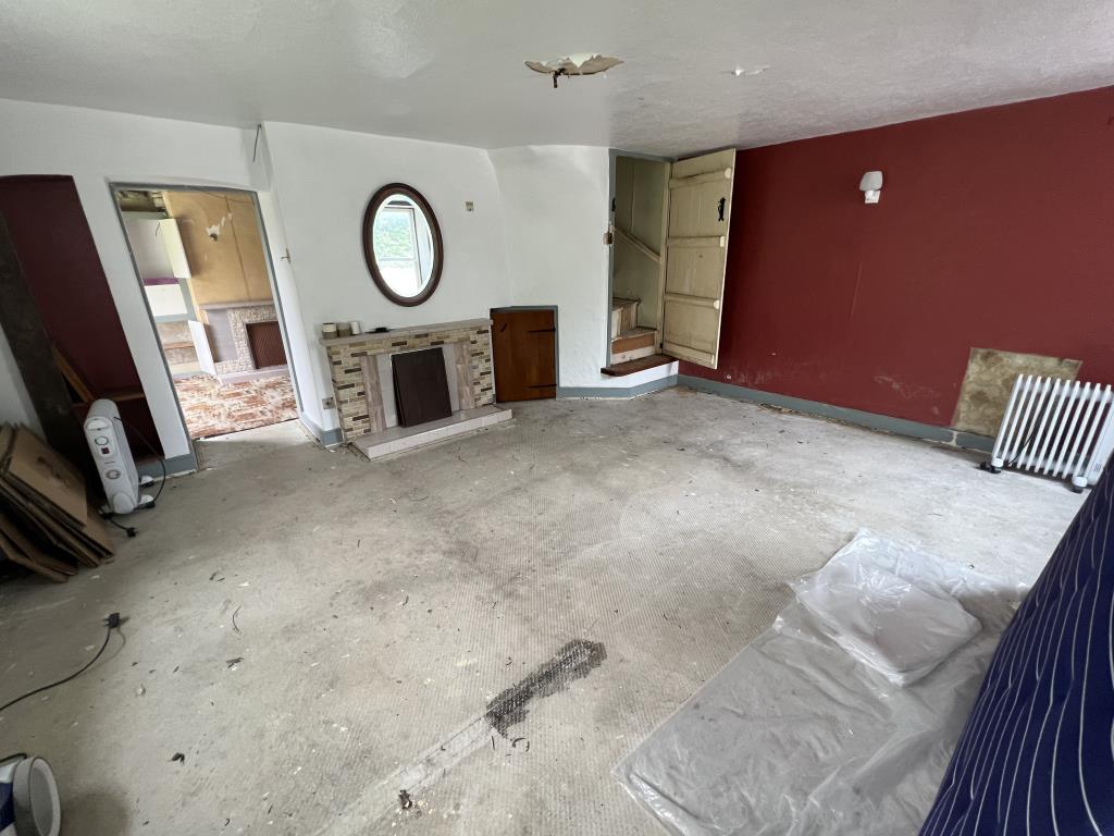 Lot: 50 - COTTAGE FOR COMPLETE REFURBISHMENT - General view of living room of property